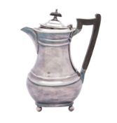 An Elizabeth II silver hot water jug, makers Mappin and Webb,