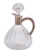 A Continental 835 silver mounted cut glass claret jug of pear-shaped outline with plain mount,