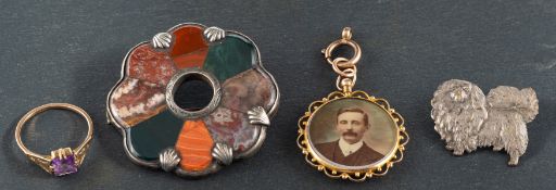 A small collection of jewellery, including an amethyst ring, stamped '9CT',