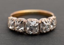 A cushion-cut diamond, five-stone ring, total estimated diamond weight ca. 3.