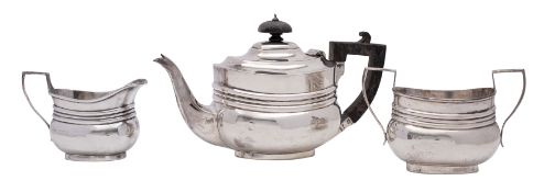 A late Victorian silver bachelors three-piece tea service, makers probably David and John Welby,
