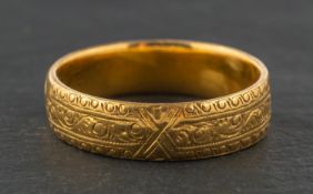 A 22ct gold, foliate engraved ring, with hallmarks for Birmingham, 1984, ring size M,