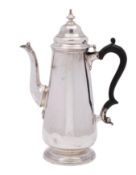 A late Victorian silver coffee pot in the George III manner, makers Goldsmiths & Silversmiths Co.