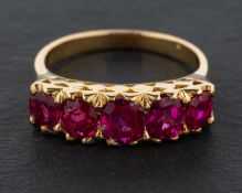 An oval, mixed-cut, five-stone ruby ring, total estimated ruby weight ca. 1.