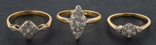 Three diamond cluster rings, including a navette-shaped ring, total estimated diamond weight ca. 0.