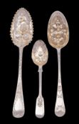 Three various silver berry spoons; George II, George III and Victorian, makers J.