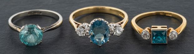 Three gemset rings, including an 18ct gold,
