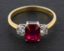 An 18ct gold, octagonal, scissor-cut synthetic ruby and round, brilliant-cut diamond,