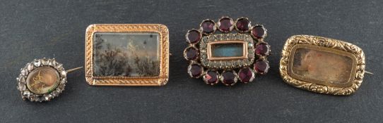 Four memorial brooches,