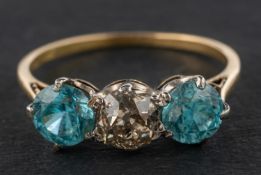 A round, mixed-cut blue zircon and old-cut diamond, three-stone ring, diamond weight ca. 0.