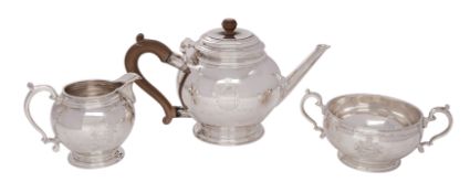 A George V silver three-piece tea service, makers Crichton Brothers, London 1929 of globular shape,