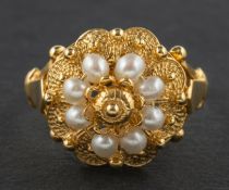 A seed pearl and cannetille ring, of flowerhead design, stamped '585', length of ring head ca. 1.