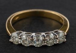 A round, brilliant-cut diamond five-stone ring, total estimated diamond weight ca. 0.