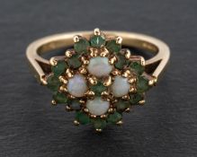 A 1970's, 9ct gold, cabochon-cut opal and round mixed-cut emerald, quatrefoil cluster ring,