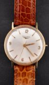 Longines, a gentleman's gold wristwatch the silvered dial with raised Arabic and baton numerals,