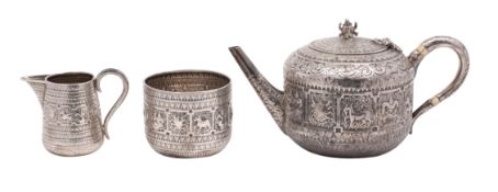 A Victorian silver three-piece tea service in the Indian manner, maker Hamilton & Inches,
