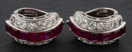 A pair of calibre-cut ruby and round, brilliant-cut diamond half-hoop earrings,