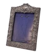 A Edward VII embossed silver mounted easel photograph frame, maker Henry Matthews, Chester 1907,