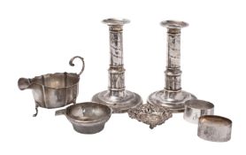 A pair of Georgian silver candlesticks (marks rubbed),
