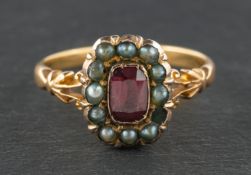A 19th century, garnet and seed pearl cluster ring, stamped '18CT', length of ring head ca. 1.