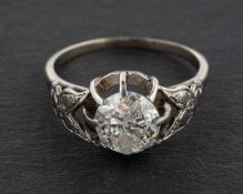 A round, brilliant-cut diamond, single-stone ring, G-H colour, SI2-P1 clarity, stamped 'PLAT',