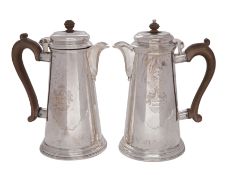A pair of George V silver hot water jugs, makers Crichton Brothers,