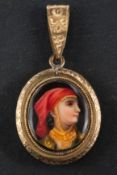 A 19th century, gold-plated, oval, locket pendant,