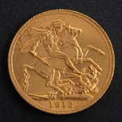 A George V sovereign coin, dated 1912, diameter ca. 22mms, total weight ca. 7.9gms.