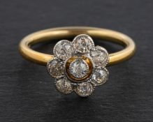 An 18ct gold, old-cut diamond flowerhead cluster ring, total estimated diamond weight ca. 0.