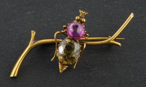 A round, mixed-cut brown zircon and cabochon-cut ruby bee brooch, total length ca.