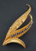 A 1960's, 18ct gold, round, brilliant-cut diamond and round, mixed-cut sapphire fern brooch,