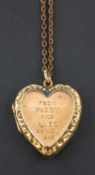 A heart-shaped locket pendant, with inscription to front, stamped '9CT', length (exl jump ring) ca.