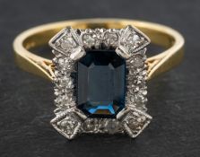 An 18ct gold, octagonal, step-cut sapphire and single-cut diamond octagonal, cluster ring,