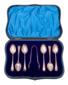 A set of six George V silver tea spoons and tongs, maker Henry Atkin, Sheffield,