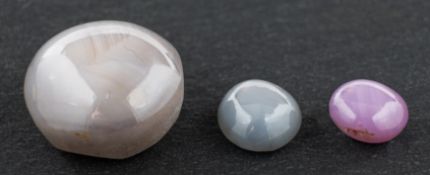 ! Three star gemstones including: an oval, grey star sapphire, weight ca. 15.05cts