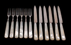 A set of six Edward VII silver and mother of pearl handled dessert knives and six matching forks,