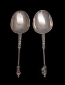 A pair of 19th Century Continental silver apostle spoons with plain oval bowls and handles with
