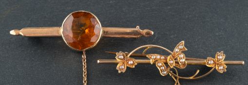 Two gemset brooches, including a round,