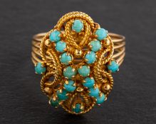 A cabochon-cut turquoise, openwork ring, length of ring head ca. 2cm, ring size M, total weight ca.