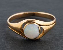 A round, cabochon-cut opal ring, estimated opal weight ca. 0.35ct, length of ring head ca. 1.