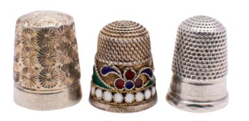 A Russian silver gilt and cloisonne enamel thimble with stylised decoration in blue, green,