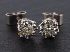 A pair of round, brilliant-cut diamond ear studs, estimated total diamond weight ca. 0.
