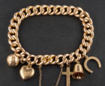 A curb-link charm bracelet, stamped '15', the majority of charms including a bell, a horseshoe,