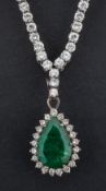 A pear-shaped emerald and round, brilliant-cut diamond cluster pendant and chain,