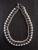 Three cultured pearl necklaces, including a cultured 'Tahitian' pearl necklace, diameter ca. 8.1-8.