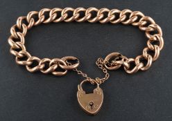 A curb-link bracelet with heart-shaped clasp, the clasp and each link stamped '9C', total length ca.