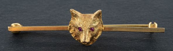 A 9ct gold, fox mask bar brooch, with rubies for eyes and hallmarks for London, 1963,