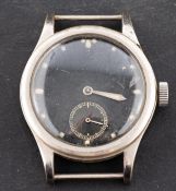 A military brass plated wristwatch the black dial with luminous dot hour markings,