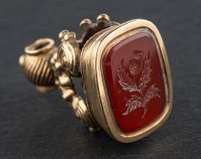 A carnelian fob engraved with a thistle motif, total length ca. 2.5cm, total weight ca. 7.1gms.