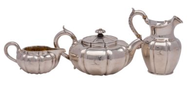 A Victorian silver three-piece tea service of Chinese influence, makers John Tapley & Co,